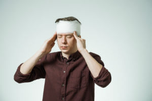 man rubbing head