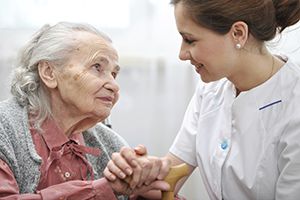 elderly patient getting help