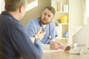 male doctor talking to patient