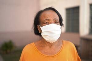 elderly black woman wearing a face mask
