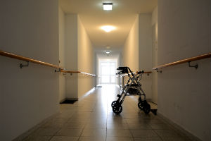 dimly lit hallway at nursing facility