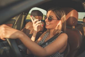 female driver talking on phone