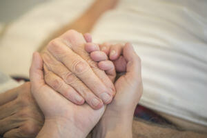 comforting elderly person
