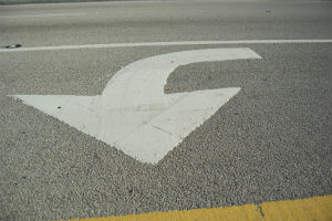 left turn signal painted on road