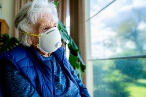 female masked nursing home resident