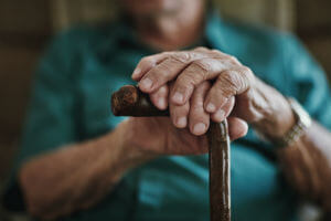 old man holding cane