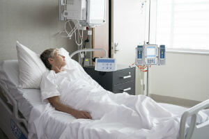 patient sleeping in hospital bed
