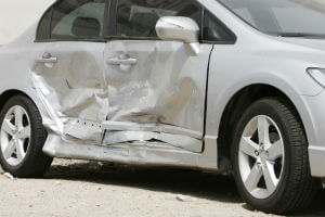 silver sedan damaged