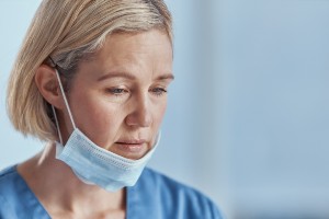 female health care worker looking tired