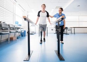 young male with prosthetic leg in physical therapy