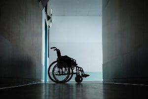 wheelchair in dark hallway - nursing home negligent security