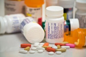 Prescription bottles and spilled pills