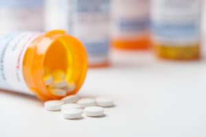 close-up image of prescription drug pill bottle on its side
