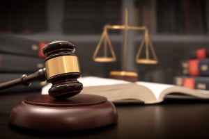 gavel on table with law books