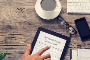 Hands filing injury claim online