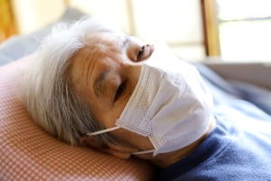 elderly woman lying down