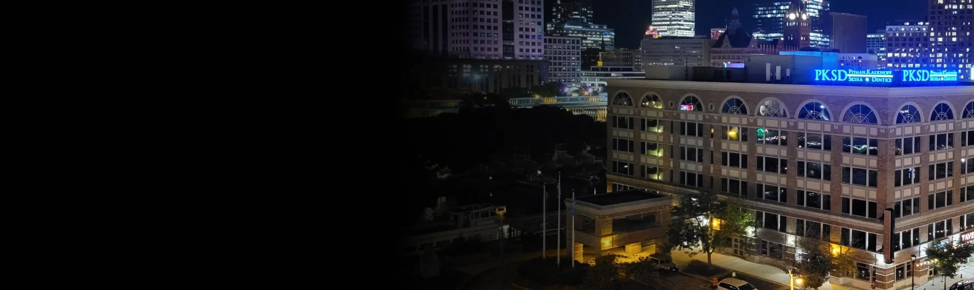 PKSD sign on building with city skyline